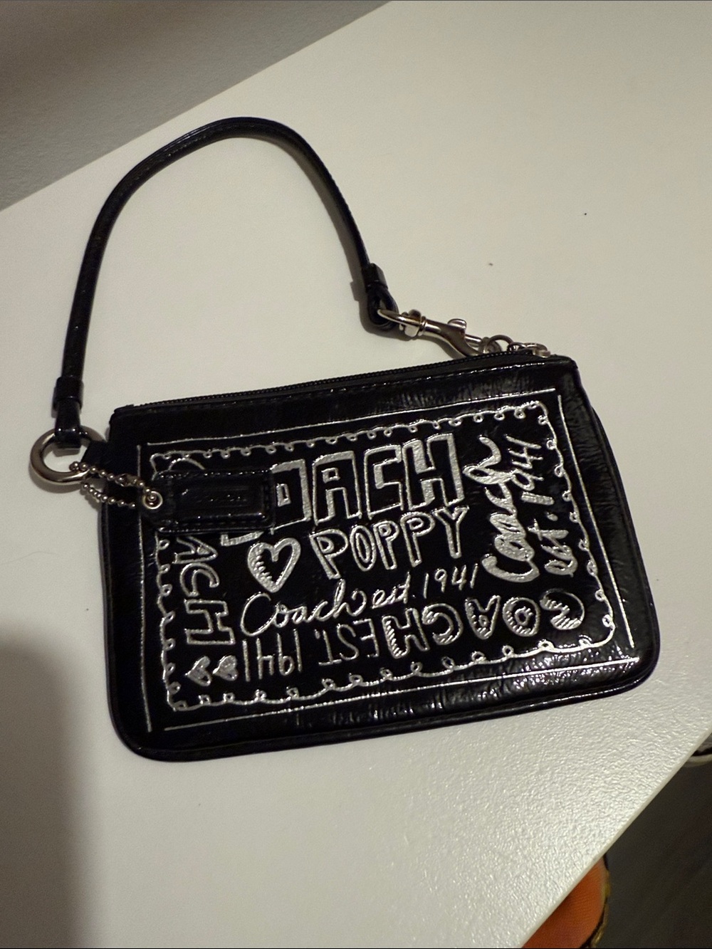 Coach Black Poppy Glossy Patent Wristlet with White Script
